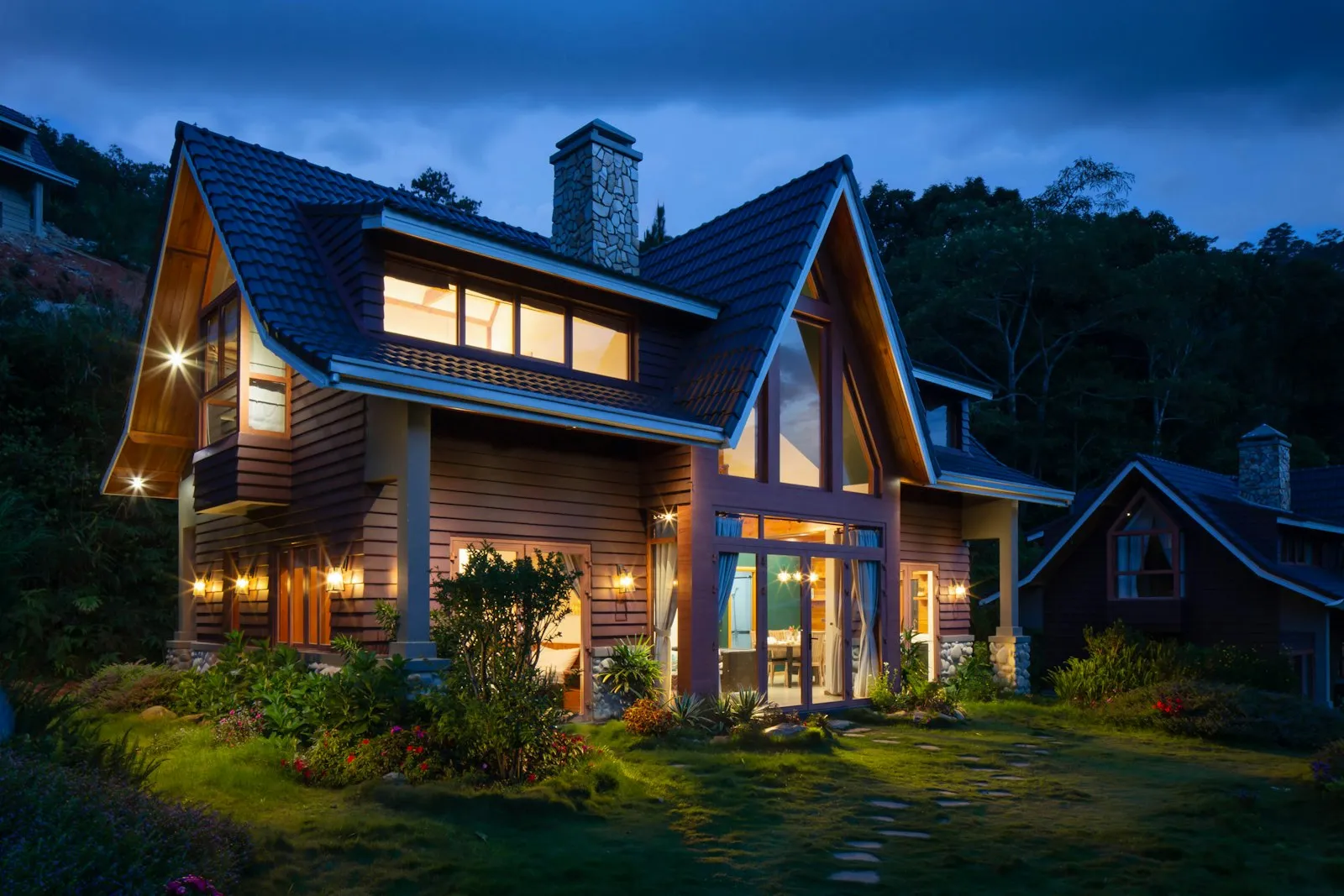 Home at dusk with warm light glowing through new energy-efficient windows