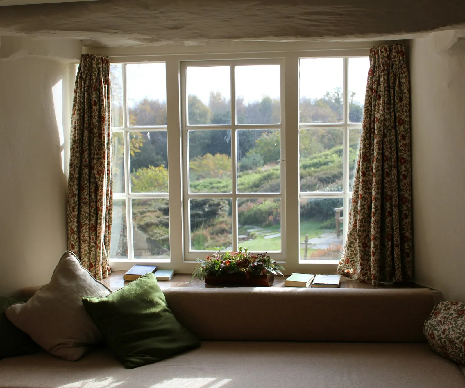 Bay window with a bench seat looking out to the yard