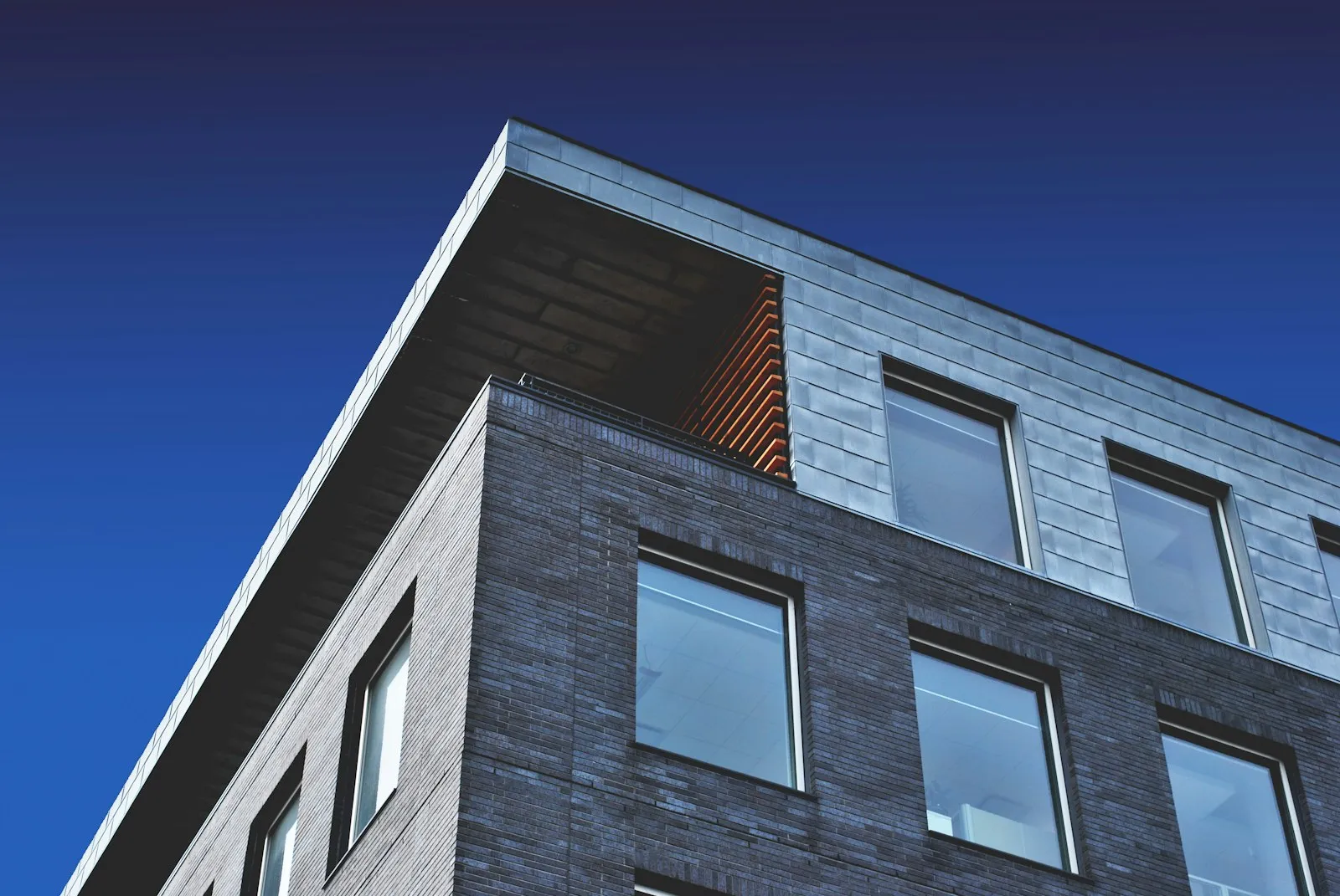 Slim dark window frames on a modern building exterior